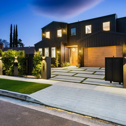 Modern luxury house exterior at dusk.